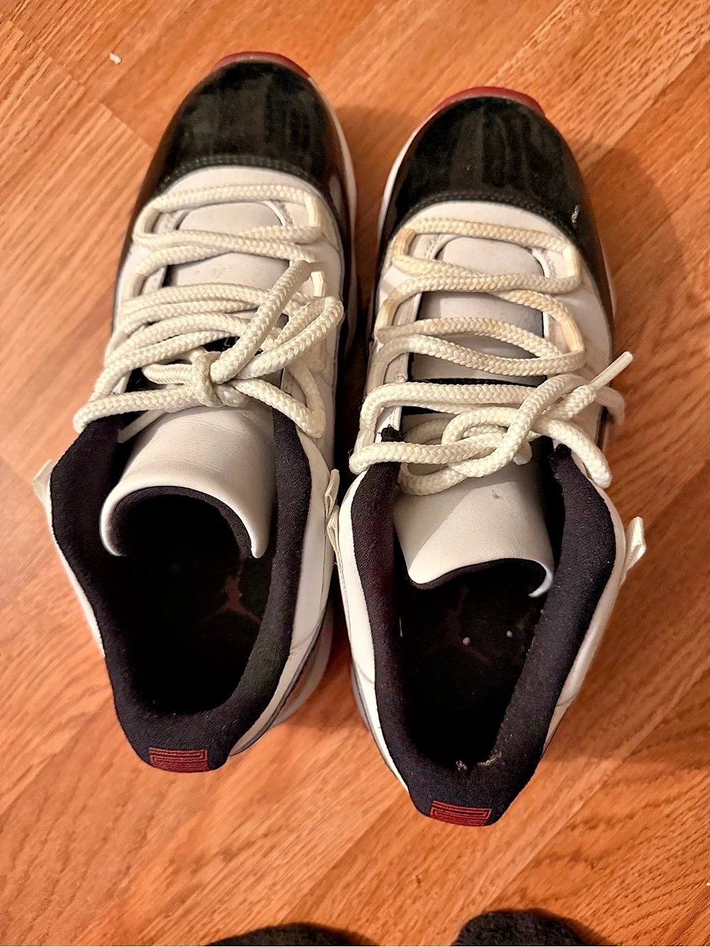 Jordan 11 Retro "Concord" sneakers in white, black, and red